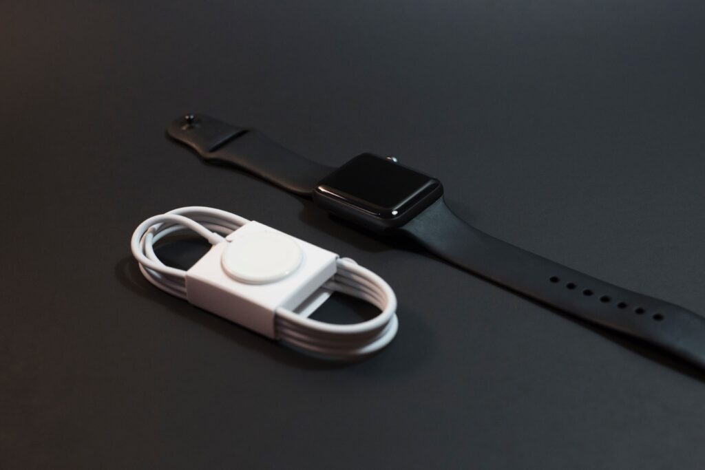 An Apple smartwatch and Its wireless charging Dock.